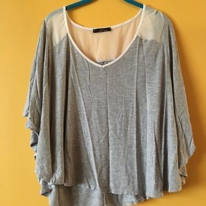 Loose-fitting grey shirt with sheer back!